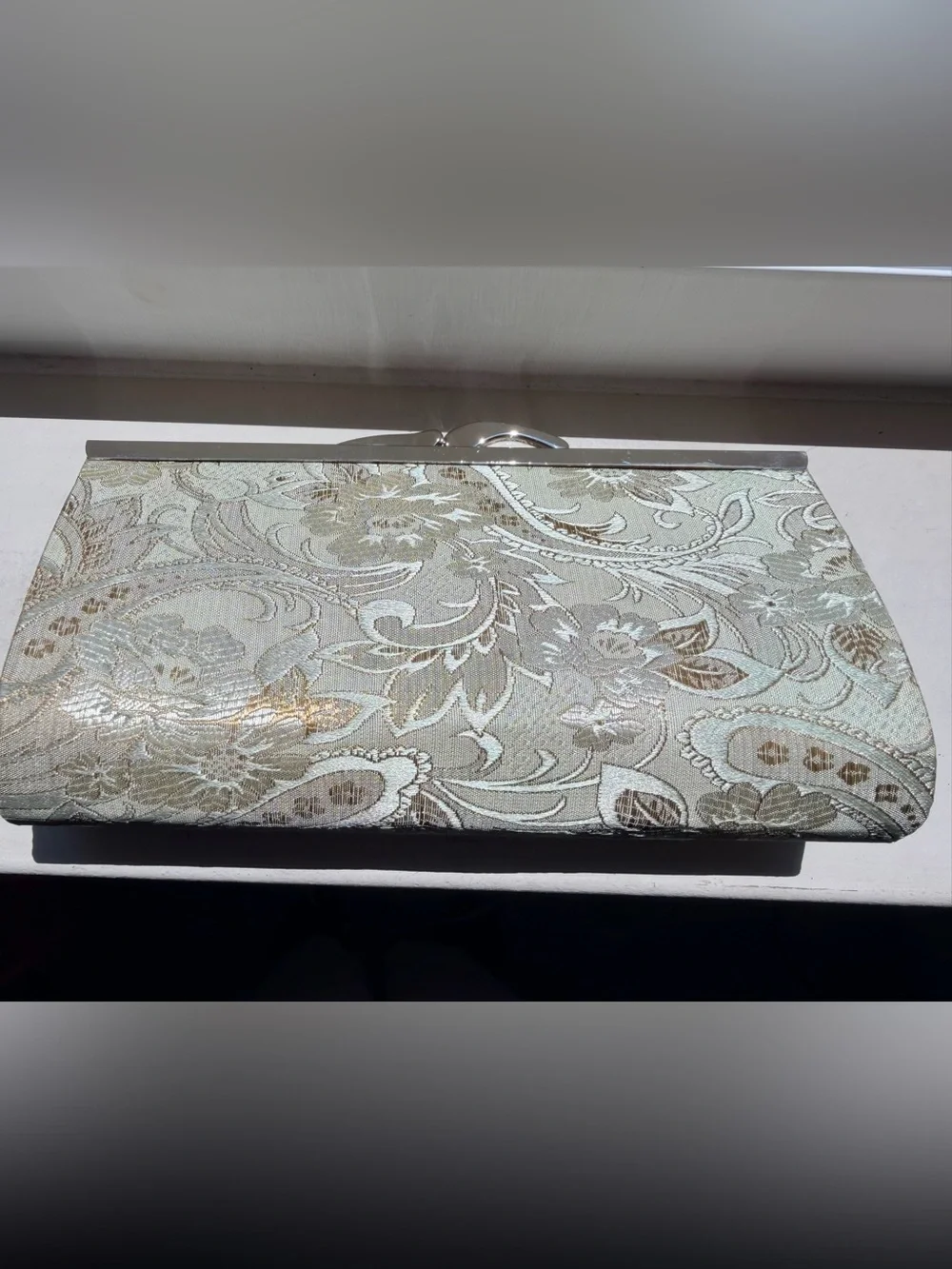 Viintage-style evening clutch features gold/green floral damask metal kiss lock